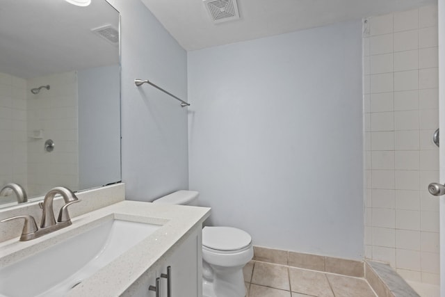4179 N Haverhill Rd Unit 609, West Palm Beach, FL 33417 - full bath featuring tile patterned flooring, vanity, toilet, and a tile shower