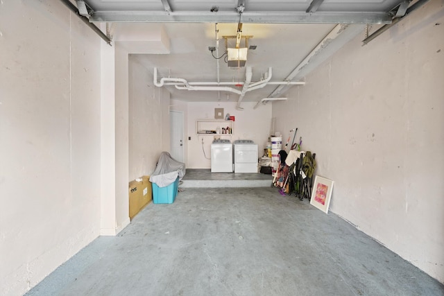 4179 N Haverhill Rd Unit 609, West Palm Beach, FL 33417 - garage featuring separate washer and dryer and a garage door opener