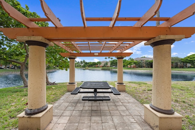 4179 N Haverhill Rd Unit 609, West Palm Beach, FL 33417 - view of patio with a water view and a pergola