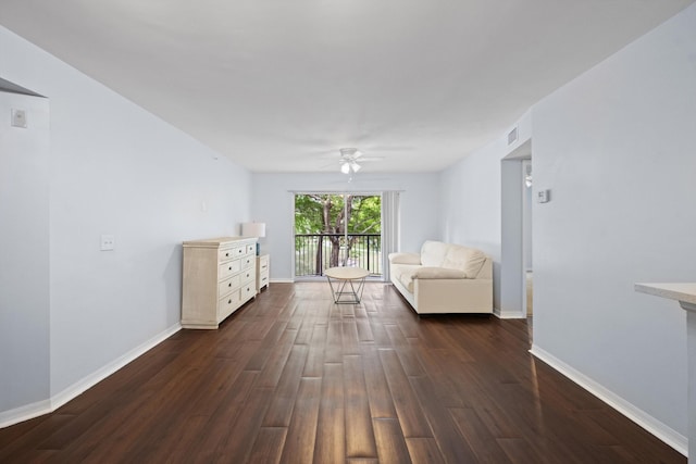 4179 N Haverhill Rd Unit 609, West Palm Beach, FL 33417 - living room with dark wood finished floors, a ceiling fan, and baseboards