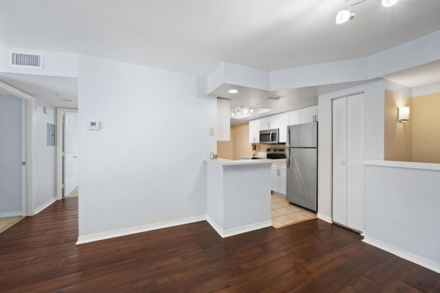 4179 N Haverhill Rd Unit 609, West Palm Beach, FL 33417 - kitchen with stainless steel appliances, baseboards, and white cabinetry
