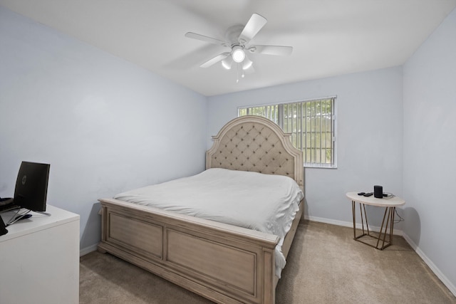 4179 N Haverhill Rd Unit 609, West Palm Beach, FL 33417 - bedroom with light carpet, baseboards, and ceiling fan