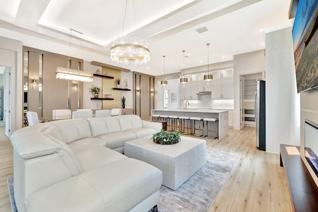 17135 SW Ambrose Way, Port Saint Lucie, FL 34986 - living area featuring light wood-style floors, recessed lighting, and a chandelier