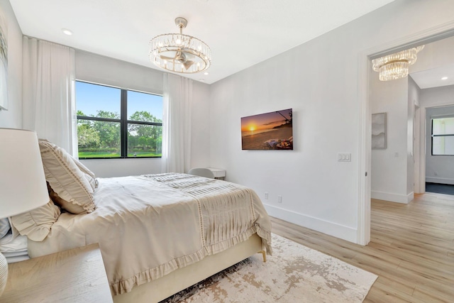 17135 SW Ambrose Way, Port Saint Lucie, FL 34986 - bedroom featuring a chandelier, baseboards, multiple windows, and recessed lighting