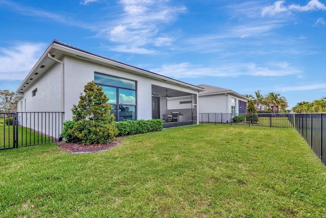 17135 SW Ambrose Way, Port Saint Lucie, FL 34986 - rear view of house with stucco siding, a sunroom, and ceiling fan