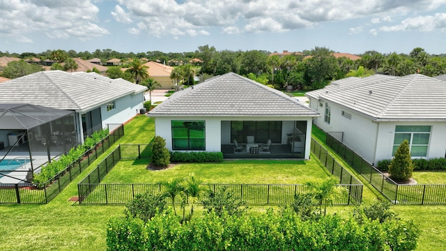 17135 SW Ambrose Way, Port Saint Lucie, FL 34986 - rear view of property featuring a tile roof, a sunroom, stucco siding, and a residential view