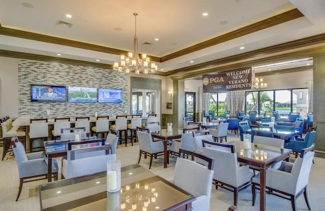 17135 SW Ambrose Way, Port Saint Lucie, FL 34986 - dining space featuring a chandelier, ornamental molding, wallpapered walls, an accent wall, and recessed lighting