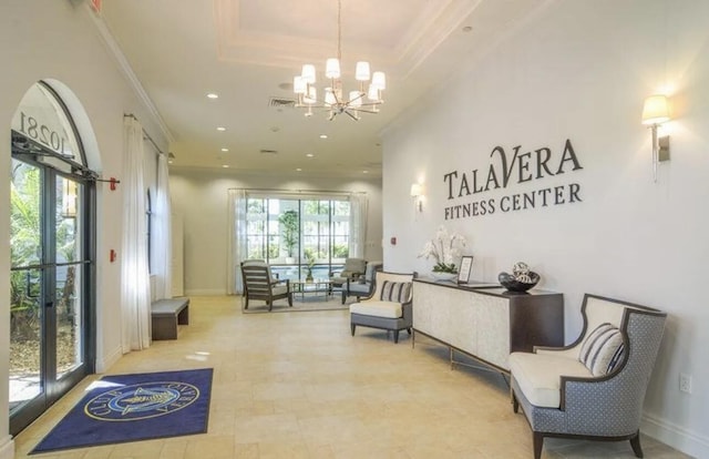17135 SW Ambrose Way, Port Saint Lucie, FL 34986 - reception area with a chandelier, crown molding, recessed lighting, and french doors