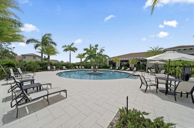 17135 SW Ambrose Way, Port Saint Lucie, FL 34986 - community pool featuring a patio area