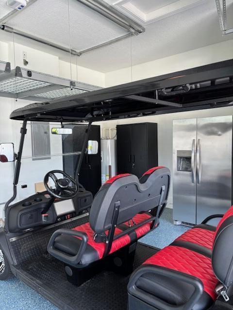 17135 SW Ambrose Way, Port Saint Lucie, FL 34986 - garage with stainless steel refrigerator with ice dispenser