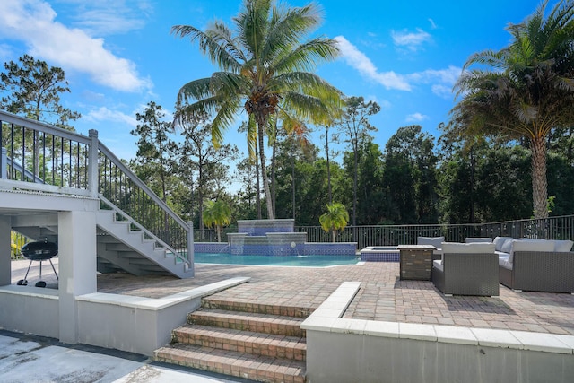 16189 Alexander Run, Jupiter, FL 33478 - view of swimming pool featuring a patio, an outdoor hangout area, stairway, and an outdoor hot tub