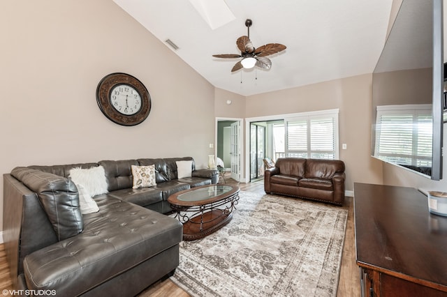 805 Harbour Pointe Way, Greenacres, FL 33413 - living area with a skylight, wood finished floors, ceiling fan, baseboards, and high vaulted ceiling