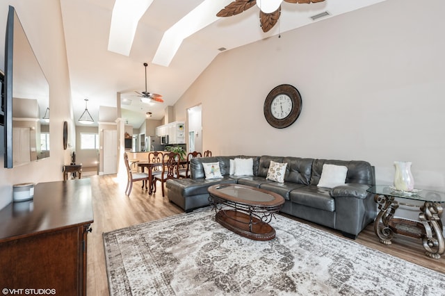 805 Harbour Pointe Way, Greenacres, FL 33413 - living area with ceiling fan, light wood-type flooring, a skylight, and lofted ceiling