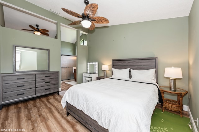 805 Harbour Pointe Way, Greenacres, FL 33413 - bedroom with lofted ceiling, wood finished floors, ceiling fan, and baseboards