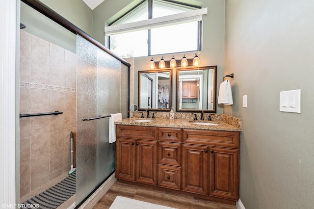 805 Harbour Pointe Way, Greenacres, FL 33413 - bathroom featuring a stall shower, wood finished floors, and double vanity