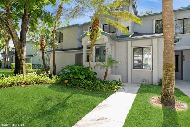 805 Harbour Pointe Way, Greenacres, FL 33413 - view of front facade featuring stucco siding and a front lawn