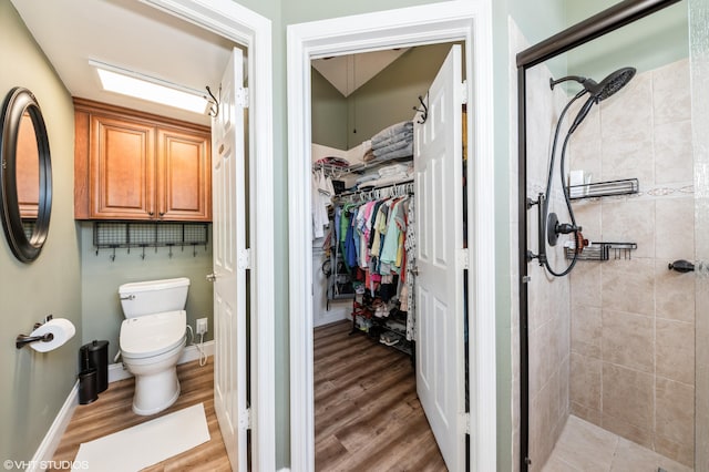 805 Harbour Pointe Way, Greenacres, FL 33413 - bathroom with a shower stall, toilet, a spacious closet, and wood finished floors