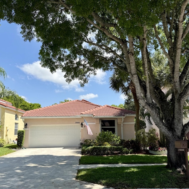 7906 Rockport Cir, Lake Worth, FL 33467 - view of front of house with a garage, stucco siding, and a tile roof