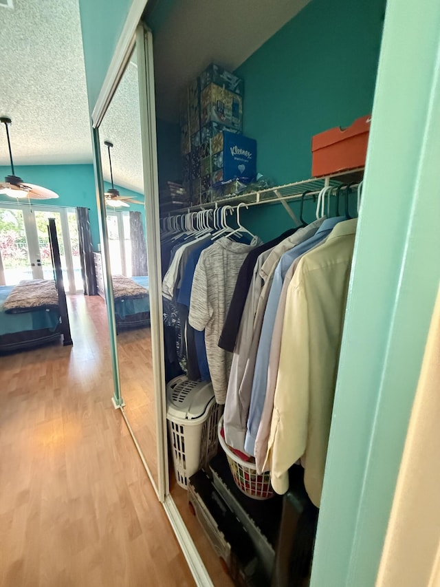7906 Rockport Cir, Lake Worth, FL 33467 - walk in closet featuring ceiling fan, wood finished floors, and lofted ceiling