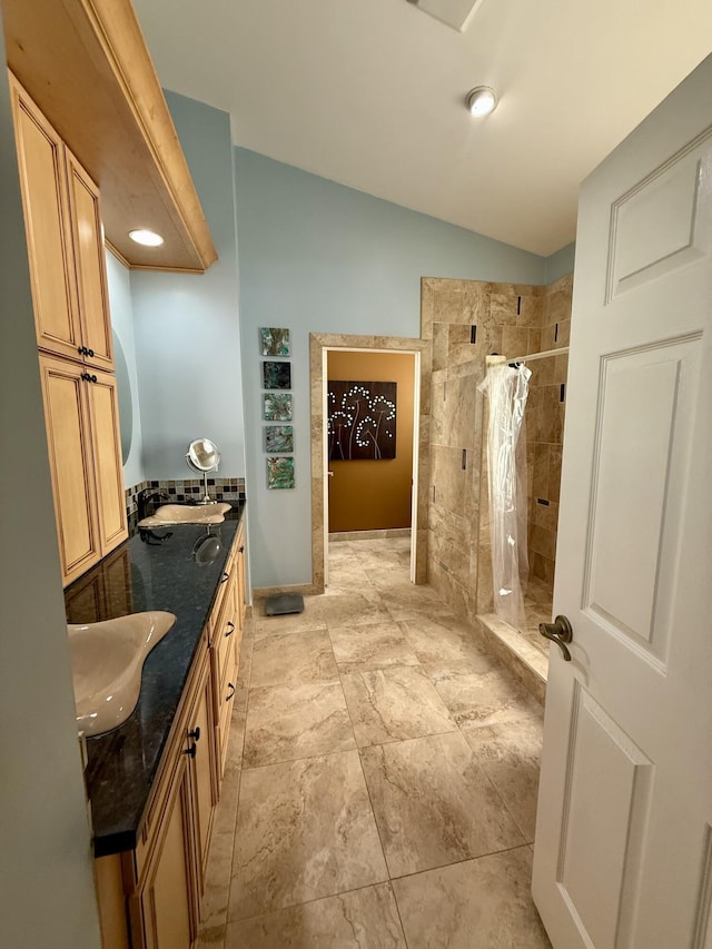 7906 Rockport Cir, Lake Worth, FL 33467 - bathroom featuring a shower stall, vaulted ceiling, and double vanity