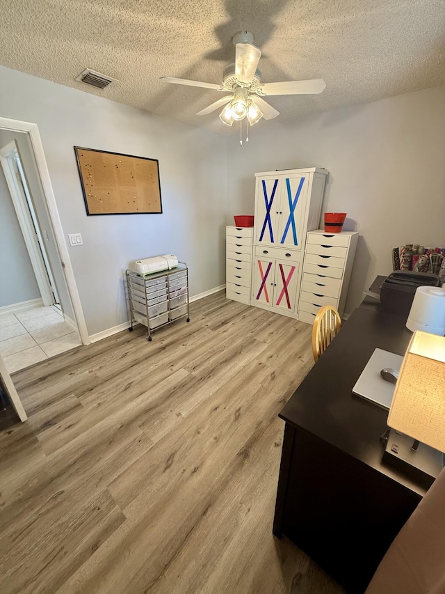 7906 Rockport Cir, Lake Worth, FL 33467 - home office featuring ceiling fan, wood finished floors, a textured ceiling, and baseboards