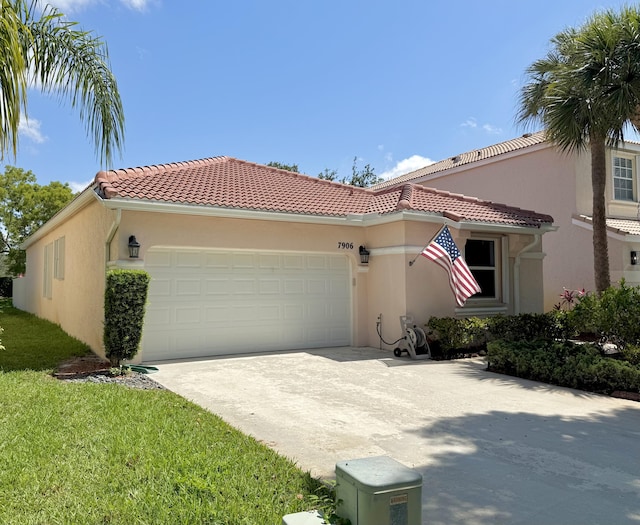 7906 Rockport Cir, Lake Worth, FL 33467 - mediterranean / spanish home featuring an attached garage, stucco siding, driveway, a tile roof, and a front yard