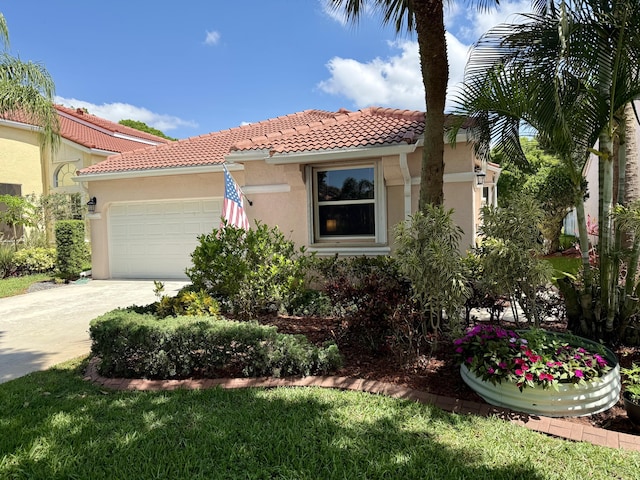 7906 Rockport Cir, Lake Worth, FL 33467 - mediterranean / spanish house with a tile roof, stucco siding, an attached garage, and concrete driveway