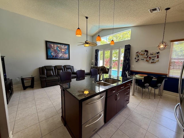 7906 Rockport Cir, Lake Worth, FL 33467 - kitchen with a sink, a textured ceiling, light tile patterned floors, lofted ceiling, and decorative light fixtures