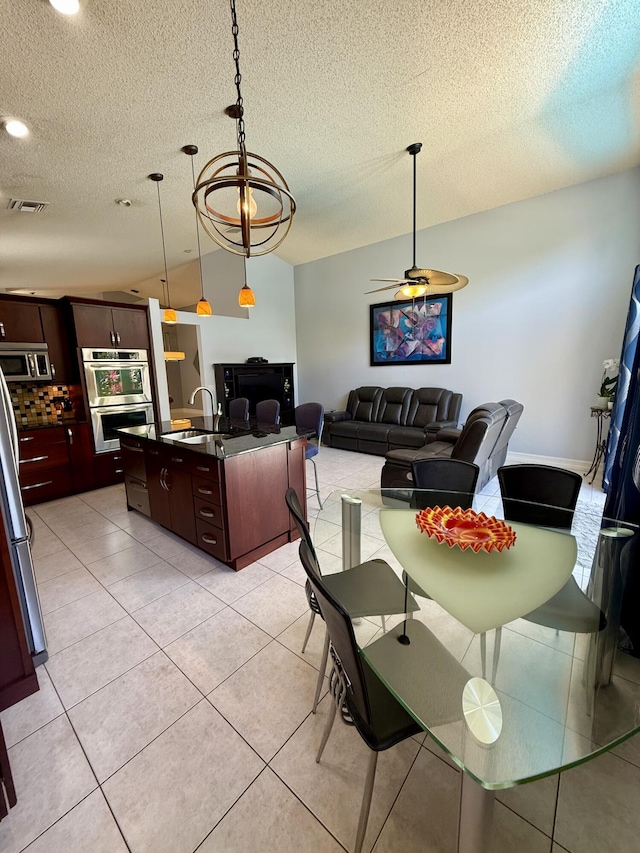 7906 Rockport Cir, Lake Worth, FL 33467 - dining room featuring a textured ceiling, vaulted ceiling, ceiling fan, light tile patterned flooring, and recessed lighting