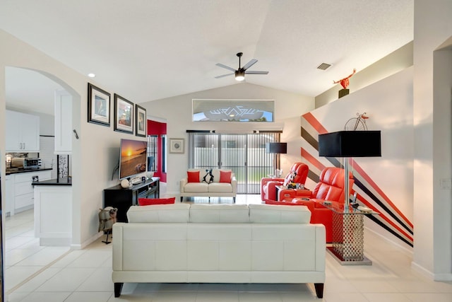 7566 San Pedro St, Boynton Beach, FL 33437 - living area with arched walkways, a ceiling fan, lofted ceiling, light tile patterned floors, and baseboards