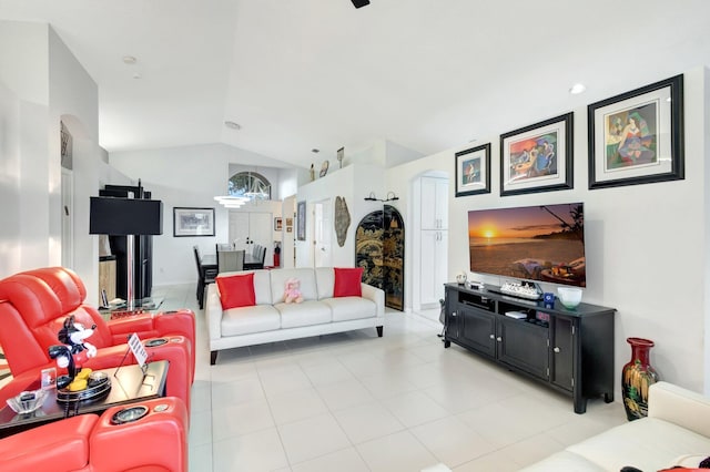 7566 San Pedro St, Boynton Beach, FL 33437 - living room featuring vaulted ceiling, arched walkways, and light tile patterned flooring