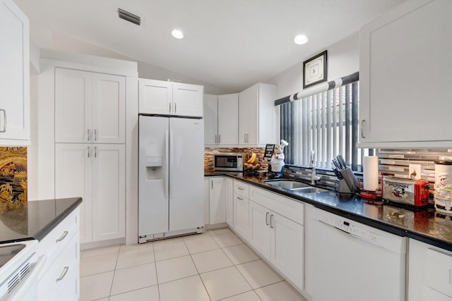 7566 San Pedro St, Boynton Beach, FL 33437 - kitchen featuring white appliances, a sink, decorative backsplash, lofted ceiling, and white cabinets