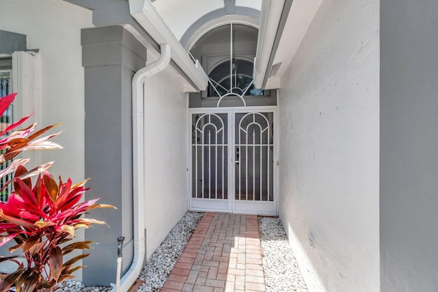 7566 San Pedro St, Boynton Beach, FL 33437 - property entrance featuring stucco siding and a gate