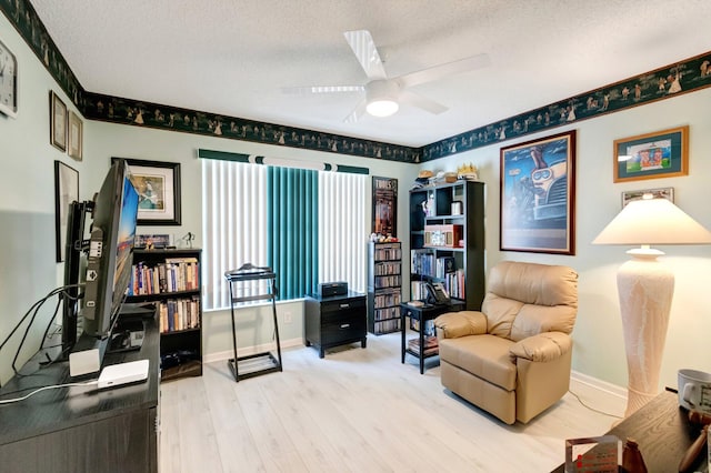 7566 San Pedro St, Boynton Beach, FL 33437 - office featuring a textured ceiling, wood finished floors, a ceiling fan, and baseboards