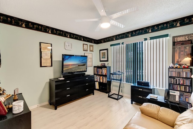 7566 San Pedro St, Boynton Beach, FL 33437 - living area with wood finished floors, a ceiling fan, and baseboards