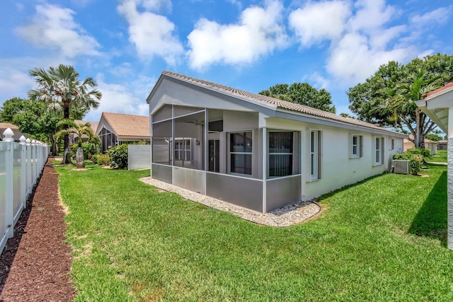 7566 San Pedro St, Boynton Beach, FL 33437 - back of house with stucco siding, a sunroom, cooling unit, and a tile roof
