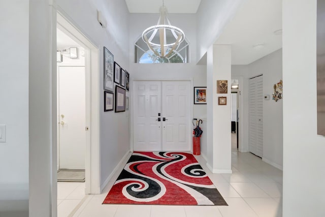 7566 San Pedro St, Boynton Beach, FL 33437 - foyer with a chandelier, baseboards, and a towering ceiling
