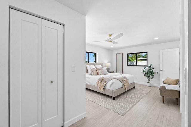 812 Chapel Hill Blvd, Boynton Beach, FL 33435 - bedroom with baseboards, light wood-style floors, ceiling fan, and a closet