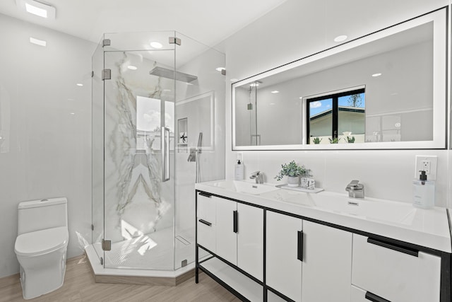812 Chapel Hill Blvd, Boynton Beach, FL 33435 - bathroom with toilet, a marble finish shower, vanity, and wood finished floors