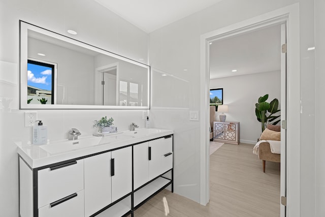 812 Chapel Hill Blvd, Boynton Beach, FL 33435 - ensuite bathroom with wood finished floors, double vanity, baseboards, and recessed lighting