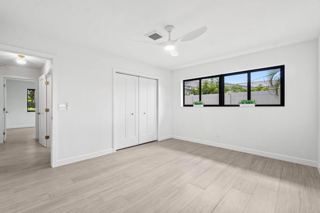 812 Chapel Hill Blvd, Boynton Beach, FL 33435 - unfurnished bedroom with baseboards, a closet, and light wood finished floors