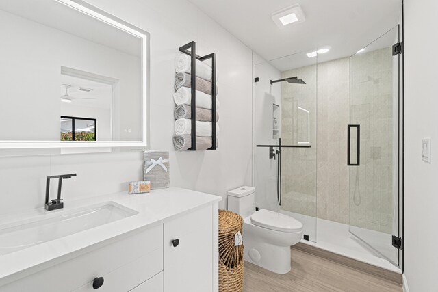 812 Chapel Hill Blvd, Boynton Beach, FL 33435 - bathroom featuring toilet, a shower stall, vanity, and wood finished floors