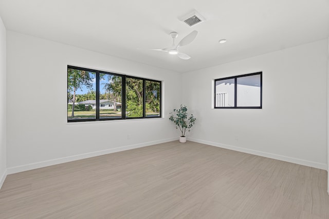812 Chapel Hill Blvd, Boynton Beach, FL 33435 - empty room featuring plenty of natural light, light wood finished floors, a ceiling fan, and baseboards