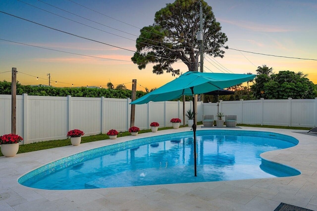 812 Chapel Hill Blvd, Boynton Beach, FL 33435 - pool at dusk featuring a fenced backyard