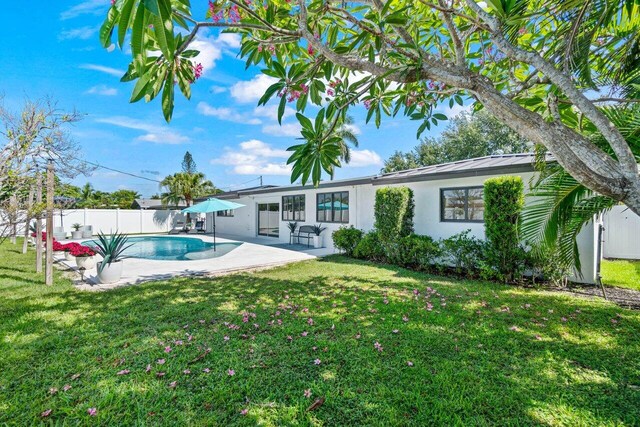 812 Chapel Hill Blvd, Boynton Beach, FL 33435 - back of property featuring a patio area, stucco siding, a standing seam roof, and metal roof