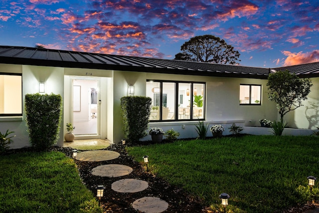 812 Chapel Hill Blvd, Boynton Beach, FL 33435 - view of front of property featuring a standing seam roof, metal roof, and stucco siding