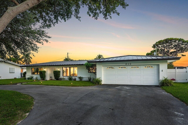 812 Chapel Hill Blvd, Boynton Beach, FL 33435 - ranch-style home with a standing seam roof, driveway, stucco siding, and a metal roof