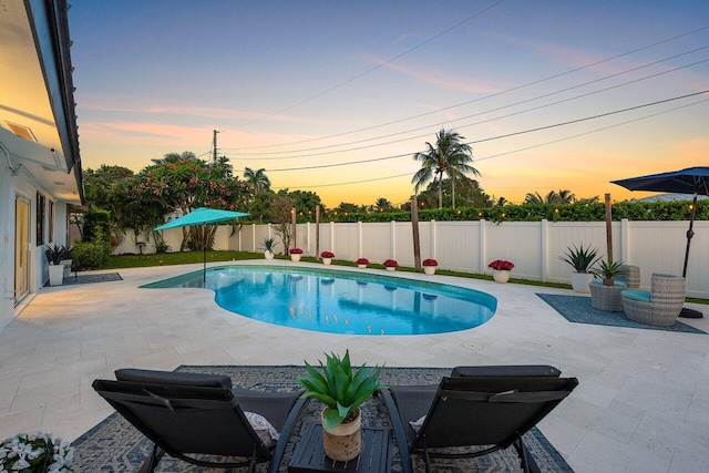 812 Chapel Hill Blvd, Boynton Beach, FL 33435 - pool at dusk with a patio and a fenced backyard