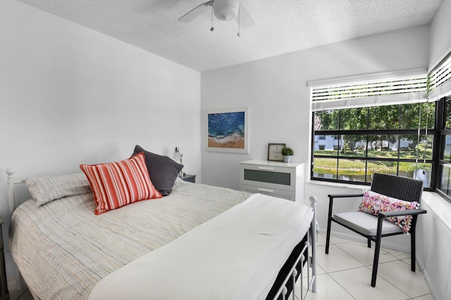 5451 Verona Dr Unit M, Boynton Beach, FL 33437 - bedroom with a textured ceiling, ceiling fan, and light tile patterned floors