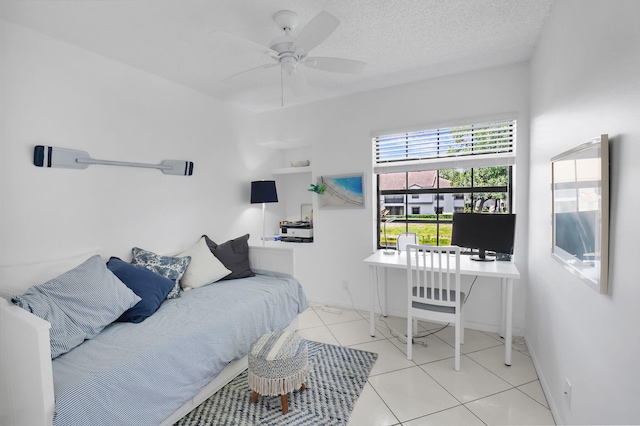 5451 Verona Dr Unit M, Boynton Beach, FL 33437 - bedroom with tile patterned floors, baseboards, an office area, ceiling fan, and a textured ceiling